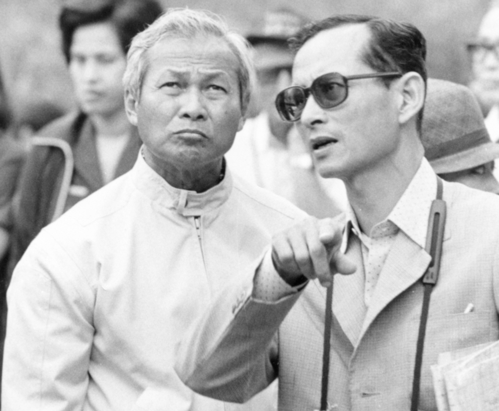 Thai King Bhumibol Adulyadej (right) talks with then-Prime Minister Prem Tinsulanonda during their visit to an irrigation project in northern Thailand, Feb. 16, 1981. [AP]