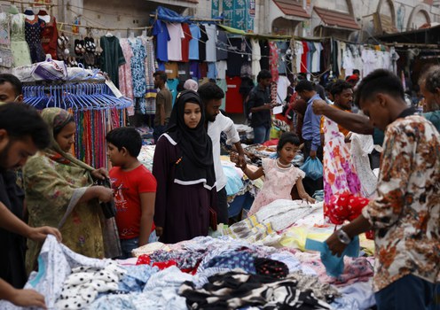 People shop for clothes at Dhaka’s New Market area ahead of the Eid al-Fitr celebration, which will be the first one since the fall of Sheikh Hasina, the authoritarian former prime minister, March 2, 2025.