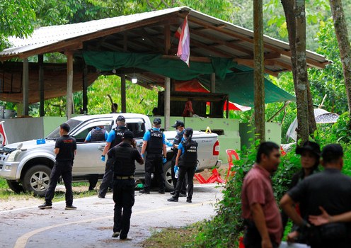 Thai forensic experts examine the site where suspected separatist insurgents killed village defense volunteers in Yala province, southern Thailand, Nov. 6, 2019.