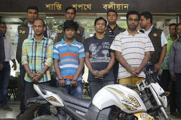 Four suspects (front row) in the murder of Italian aid worker Cesare Tavella are paraded before reporters outside Dhaka Metropolitan Police headquarters, Oct. 26, 2015.