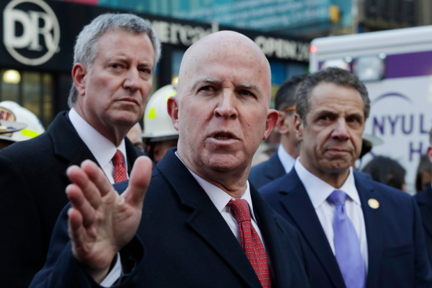 New York City Police Commissioner James O’Neill holds a news conference outside the Port Authority Bus Terminal in Manhattan with Mayor Bill de Blasio (left) and Gov. Andrew Cuomo, after a pipe-bomb strapped to a man exploded in a crowded subway corridor near Times Square, Dec. 11, 2017. [AP]