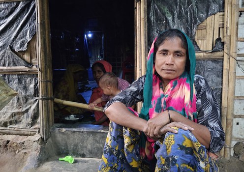 Rohingya Amena Khatun sits in front of her camp shelter in Teknaf, Cox’s Bazar, Bangladesh, March 14, 2025.