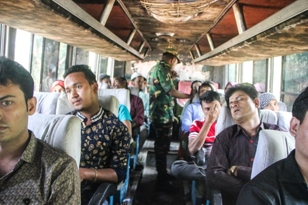 A member of the Bangladeshi security forces carries out a check on a bus to identify Rohingya refugees in Cox’s Bazar, Bangladesh, Oct. 29, 2017. (Rohit Wadhwaney/BenarNews)