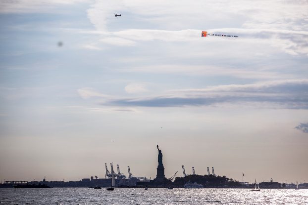 A plane towing a banner calling for Shahidul Alam to be freed in Bangladesh flies over the Statue of Liberty in New York, Sept. 30, 2018. (Photo courtesy of Wasfia Nazreen)