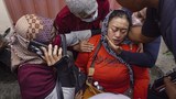 Scores killed in stadium stampede as Indonesian football fans riot