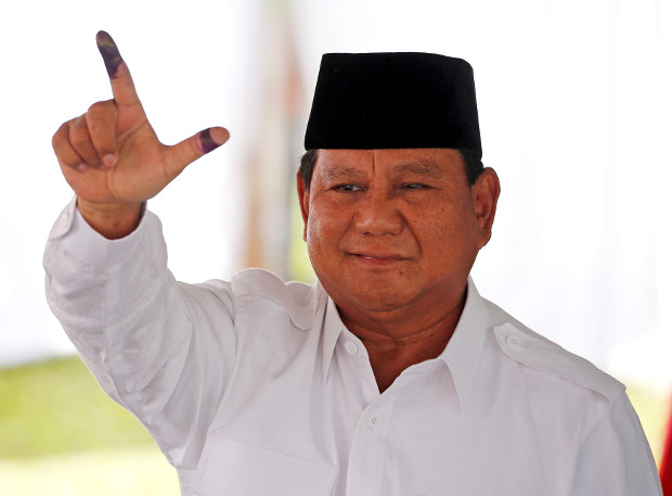 Indonesian presidential candidate Prabowo Subianto shows his ink-stained finger after casting his vote in Bogor, West Java, April 17, 2019. (Reuters)