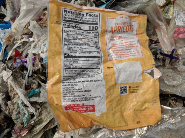 Used packaging for a food product made in the United States is seen amid a pile of trash at a dumpsite in Bekasi, Indonesia, May 16, 2019. [Ahmad Syamsudin/BenarNews]