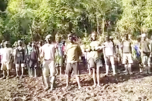 This photograph, grabbed from a video sent to BenarNews on Nov. 10, shows armed separatists training in the forest of Mimika Regency, Papua. [Victor Mambor/BenarNews] 