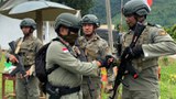 Indonesian Police Hunt for Pro-IS Militant Suspects after Killing 2 in Raid