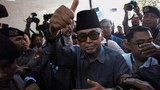 Indonesian Islamic school leader detained on blasphemy charge after Muslim groups protest