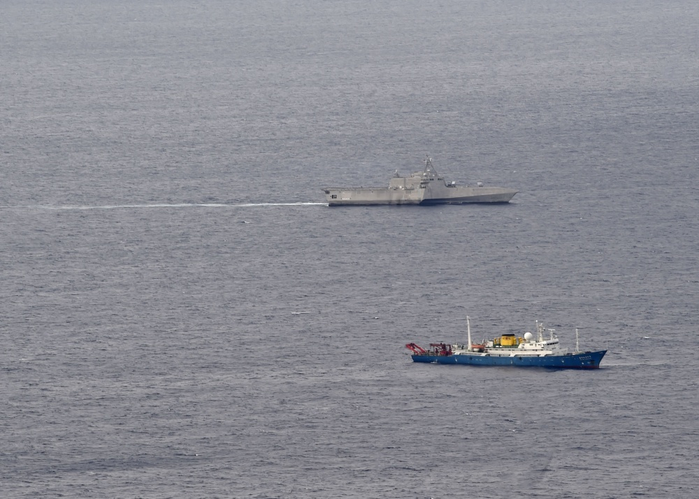 The USS Gabrielle Giffords (top) patrols in the South China Sea near the Chinese survey ship Hai Yang Di Zhi 4, July 1, 2020.
