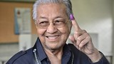 After election loss, Malaysia’s Mahathir says he will focus on writing history