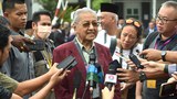 Conspiracy theories fly fast and thick as Malaysia election campaign hits road