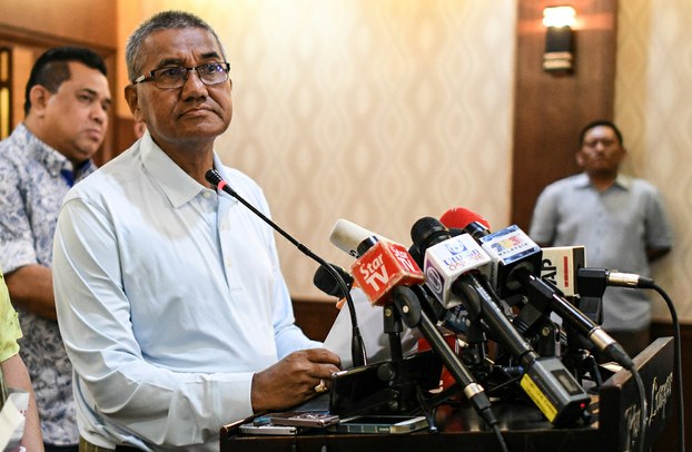 Malaysian Police Inspector-General Mohamad Fuzi Harun listens to questions during a press conference in Kuala Lumpur, April 22, 2018. [AFP]