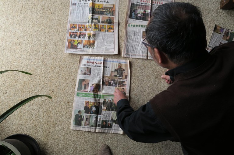 Copy of NZ media pic4 Chen Weijian looking at his discontinued newspaper.JPG Copy of NZ media pic4 Chen Weijian looking at his discontinued newspaper.JPG