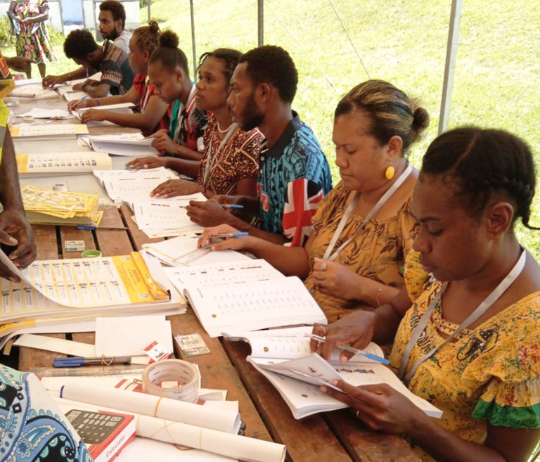 Electoral officers verifying voters identity.jpeg Electoral officers verifying voters identity.jpeg
