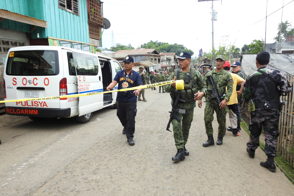 Security forces and Scene of the Crime Operatives (SOCO) prepare to cordon off the area for an investigation after an explosion in the area of a temporary camp of the 1st Brigade Combat Team in Indanan, southern Philippines, June 28, 2019. (Photo: Reuters)
