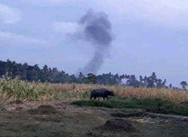 A plume of smoke is seen in the wake of a military artillery assault against suspected pro-Islamic State militants in Shariff Saydona Mustapha town in Maguindanao province, March 13, 2019. [HO/Philippine Army]