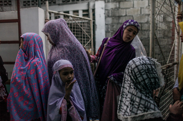 Muslim women and girls gather outside a small mosque during Eid celebrations in Marikina, Philippines, Aug. 11, 2019. [Basilio Sepe/BenarNews] 