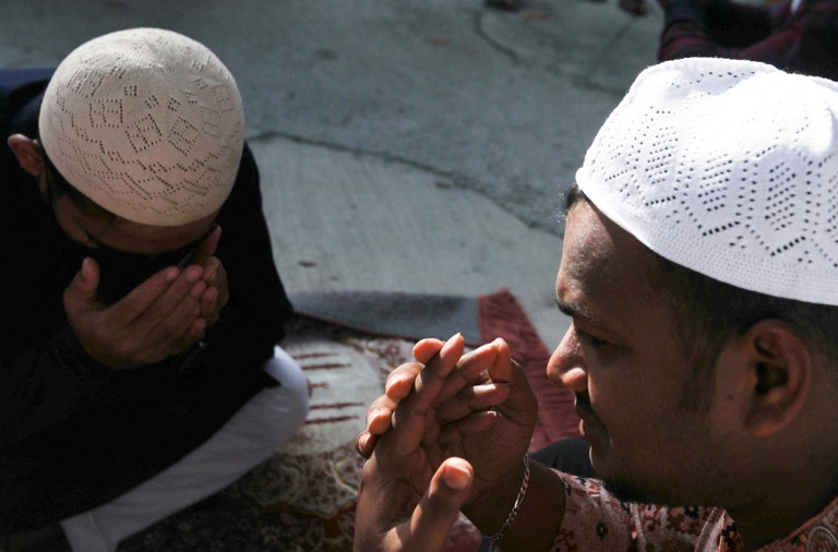 220502-eid-malay-men-pray.JPG