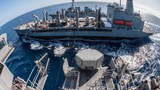 China lashes out as US Navy destroyer sails near disputed islands