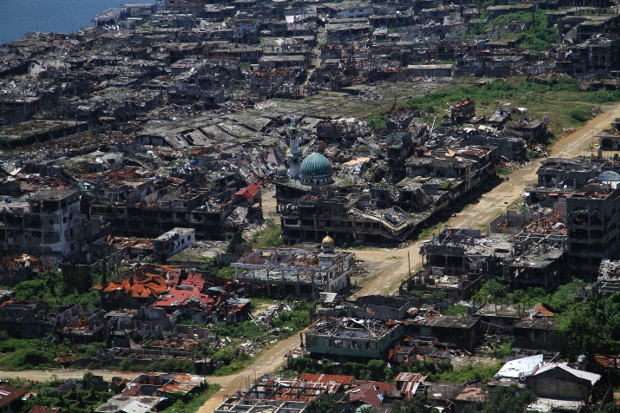 An aerial photograph shows the devastated areas of the southern Philippine city of Marawi, April 6, 2018.  [Richel V. Umel/BenarNews]