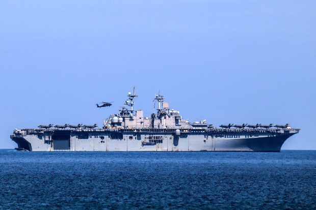 A helicopter lands on the USS Wasp during an annual joint training exercise in the western Philippine province of Zambales, April 11, 2019.  [Jay Rey/BenarNews]