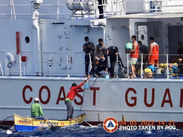 Coast guard reports more Filipino fishermen in disputed Chinese-controlled shoal Coast guard reports more Filipino fishermen in disputed Chinese-controlled shoal