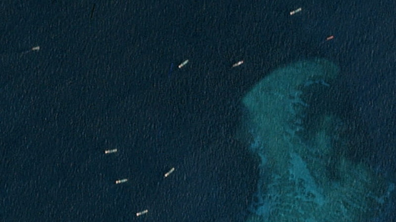 A closer-up view of the satellite image taken just north of the Chinese-occupied base at South Johnson Reef, shows multiple, unidentified ships, March 22, 2020. [Planet Labs Inc.] 