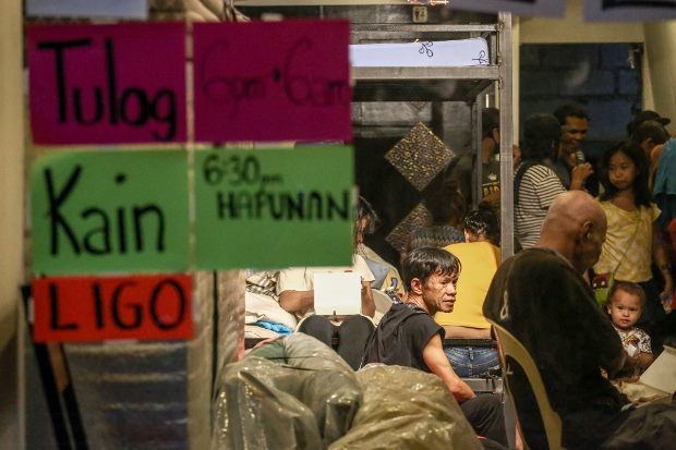 A restaurant in Quezon City, near Manila, is converted into an emergency shelter at night to cater to Philippines capital’s homeless after the government imposed a sweeping quarantine to control the spread of COVID-19, March 21, 2020. [Basilio Sepe/BenarNews]