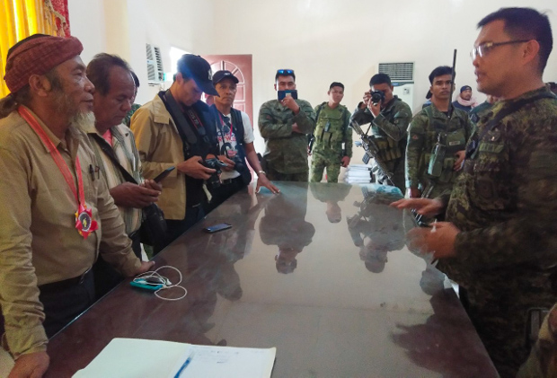 Philippines security forces (left) speak to MNLF members (right) before they were disarmed in Buluan town, capital of the southern Philippine province of Maguindanao, Sept. 15, 2019. [Handout/Philippine Army] 