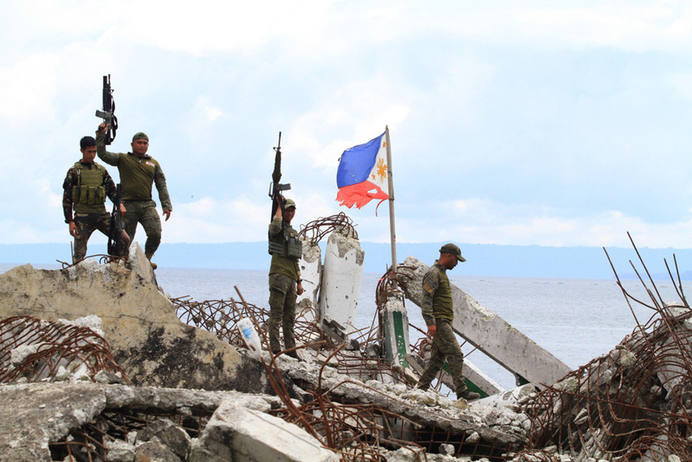 Philippine soldiers guard a section of Marawi, which was devastated by a five-month battle in 2017 with Islamic State-linked extremists who took over the southern Philippine city, April 10, 2018. (Photo: Richel V. Umel/BenarNews)