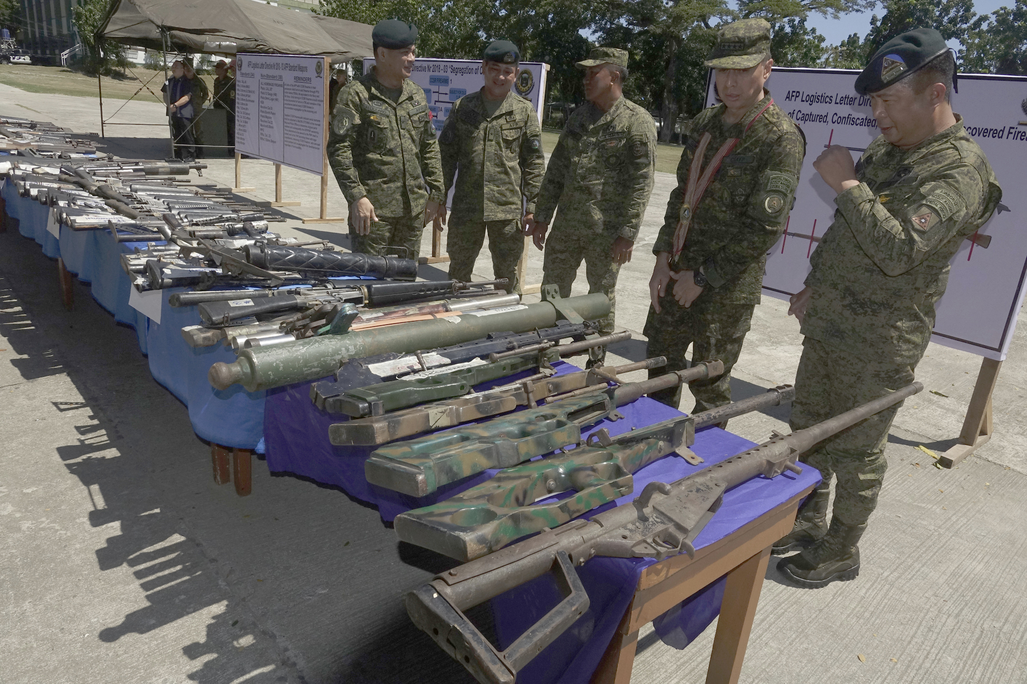 Philippine military chief Gen. Noel Clement (second from right) and army officials inspect firearms seized from suspected militants, during the general’s visit to the southern city of Zamboanga, Nov. 14, 2019. (Photo: BenarNews)