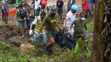 Philippine rescuers dig out bodies from huge storm-induced landslide