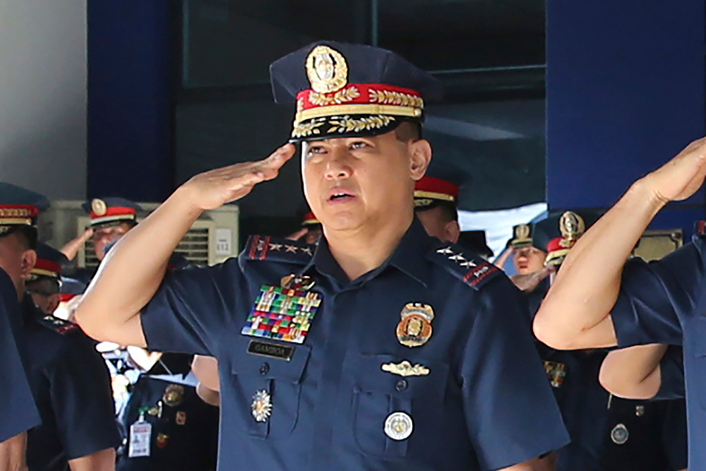 Archie Gamboa, who took over as the Phillipine police chief in January 2020, salutes during a flag-raising ceremony at Camp Crane in Quezon city, Philippines, Oct. 14, 2019. [Philippine National Police via AP]  