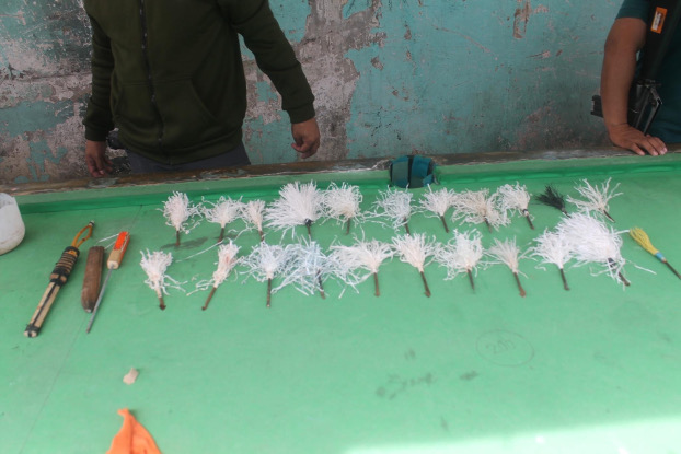 New Bilibid Prison personnel show crude weapons that were confiscated after a deadly riot was brought under control, Nov. 9, 2020. [Handout Philippines Bureau of Corrections]