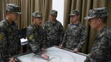 Chinese troops drive away fishing vessels from disputed waters