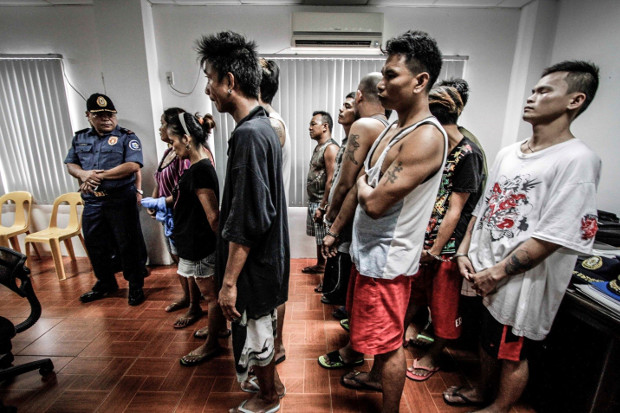 A group of suspected drug pushers and users is shown after they were rounded up by police in Dagupan, Philippines, in October 2016. (Karl Romano/BenarNews)
