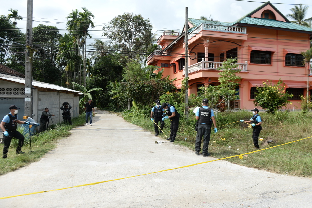 Thai police inspect the site of a drive-by shooting that killed a woman and her daughter in Bacho, a district of Narathiwat province in Thailand’s insurgency-stricken Deep South, Aug. 11, 2018. 
