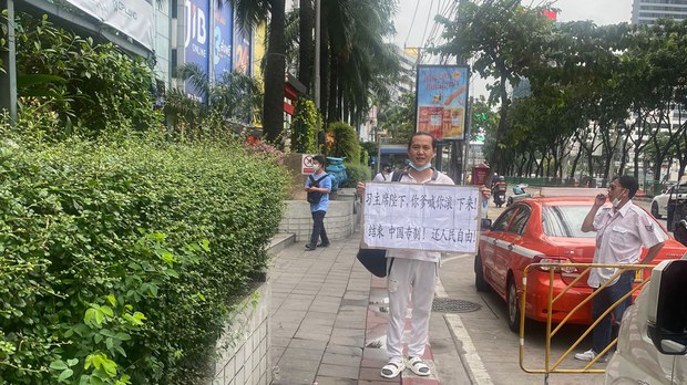 Thai police hold Chinese dissident after lone Bangkok protest against Xi Jinping Thai police hold Chinese dissident after lone Bangkok protest against Xi Jinping