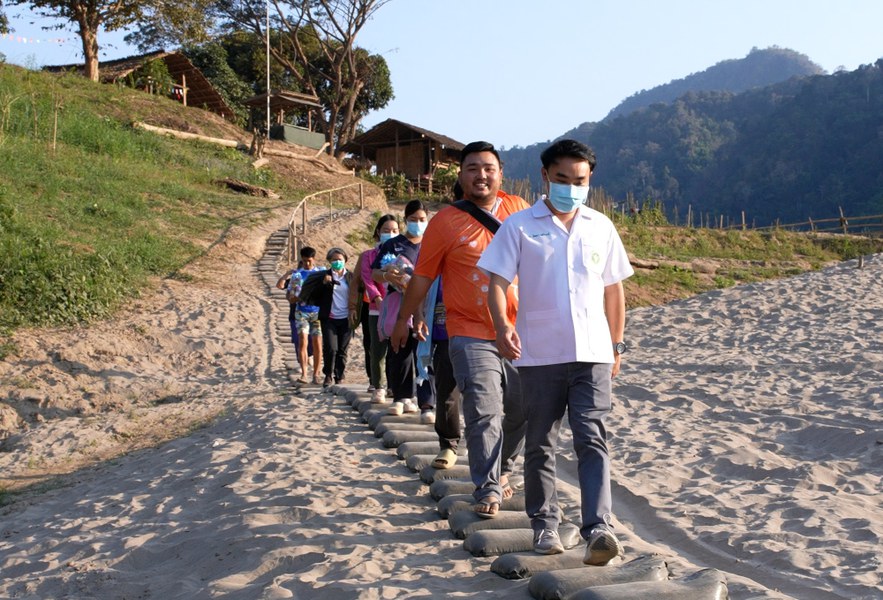 Physician Pittaya Lhawong, director of Sop Moei Hospital in Thailand’s Mae Hong Son province, travels with a public health team to examine patients in Mae Hong Son province near the border with Myanmar, Feb. 20, 2025.
