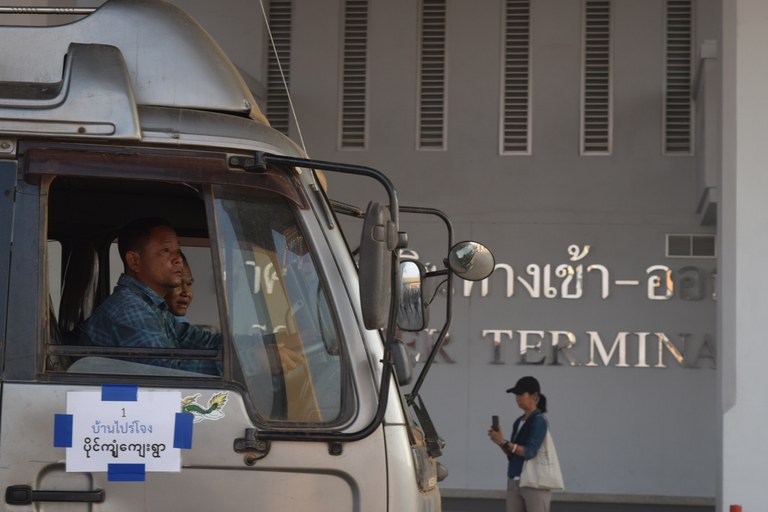 Drivers in a truck marked for Paingkyon village begin their journey outside Thailand's Customs House on March 25, 2024..JPG Drivers in a truck marked for Paingkyon village begin their journey outside Thailand's Customs House on March 25, 2024..JPG