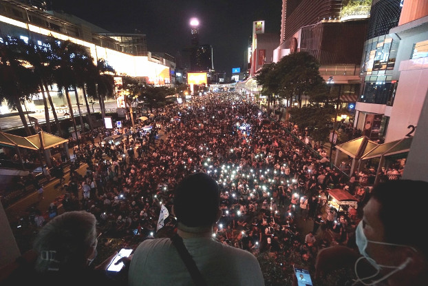 Pro-democracy activists gather near the Erawan Shrine in downtown Bangkok, one day after a rally drew pro-monarchy counter-protesters, Oct. 15, 2020. [Nontarat Phaicharoen/BenarNews] 