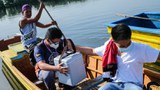 Philippines: Health Workers in Canoes Bring Vaccines to Rural Communities