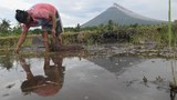 In the shadow of a Philippine volcano, scenes from people's lives